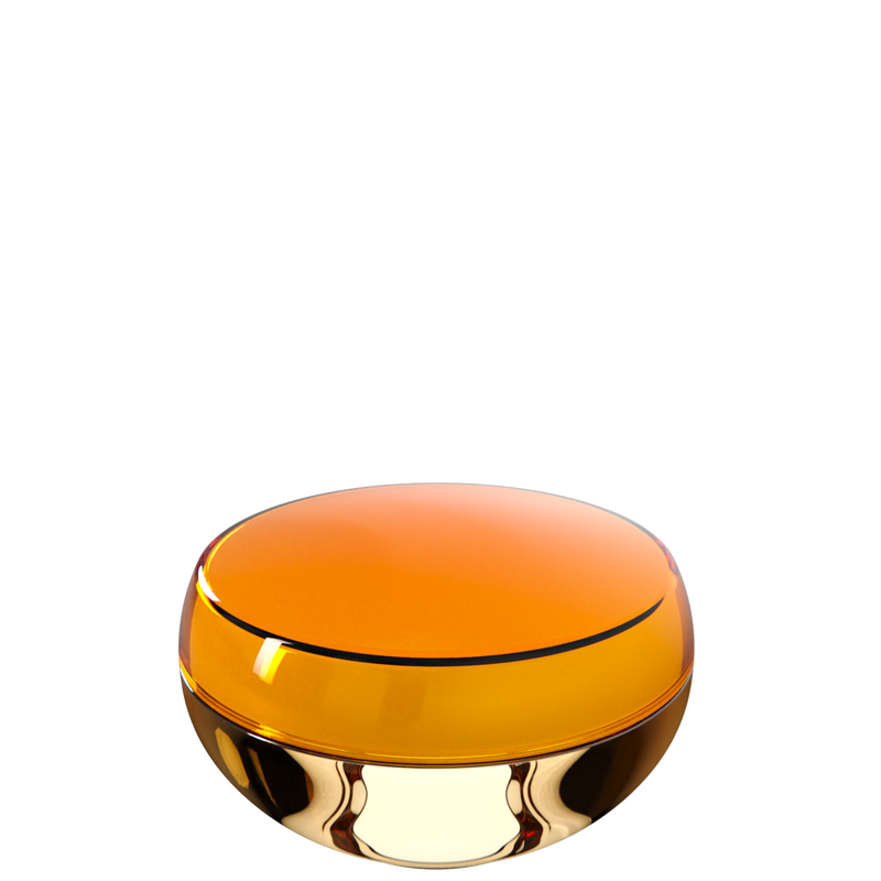 Ju 20 interchangeable cosmetic holder in amber and pale gold, angled view of the domed cap