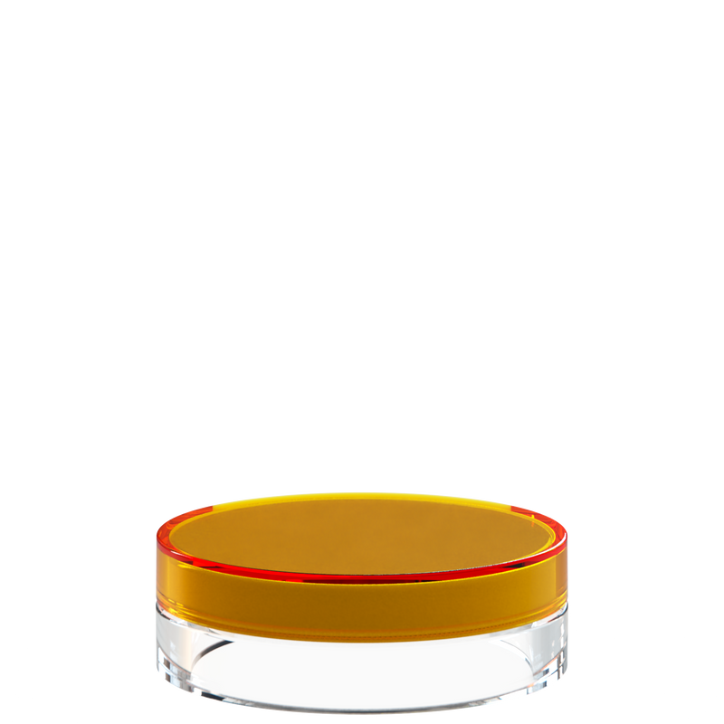 Sai 23 interchangeable cosmetic holder in gold and clear, angled view of the flat cylinder