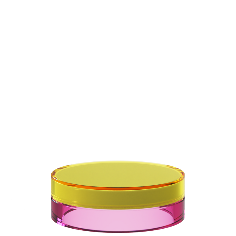 Sai 28 interchangeable cosmetic holder, yellow cap with a magenta body, angled view of the flat cylinder