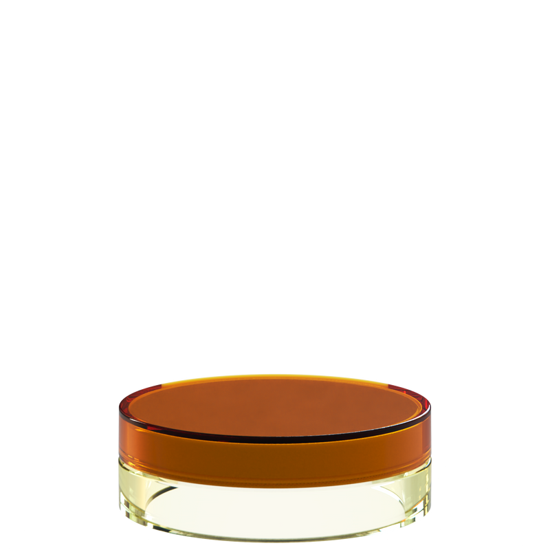 Sai 32 interchangeable cosmetic holder in amber brown and pale yellow, angled view of the flat cylinder