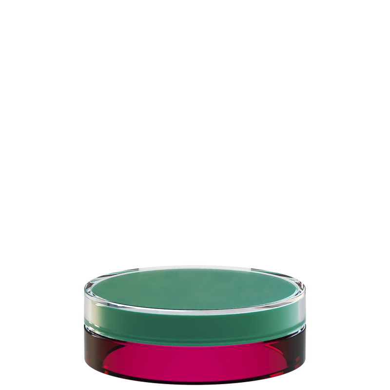 Sai 07 interchangeable cosmetic holder in green and dark burgundy, angled view of the flat cylinder